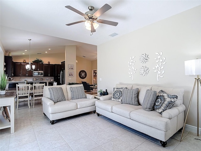 12323 House Finch, Weeki Wachee, FL 34614 - living room featuring lofted ceiling, a ceiling fan, and light tile patterned floors