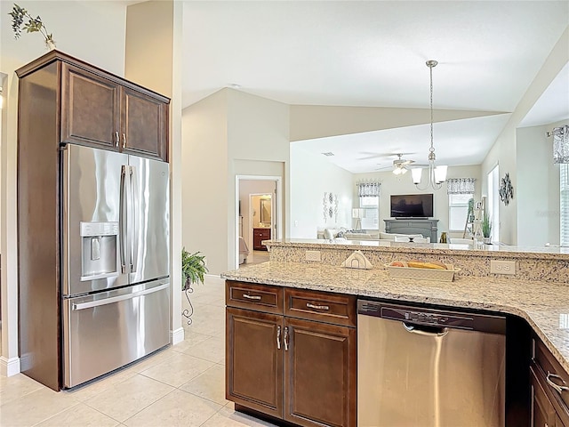 12323 House Finch, Weeki Wachee, FL 34614 - kitchen with stainless steel appliances, lofted ceiling, open floor plan, a ceiling fan, and light stone counters