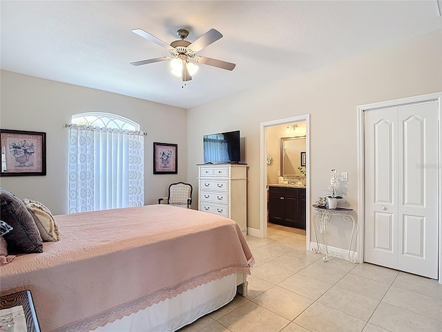 12323 House Finch, Weeki Wachee, FL 34614 - bedroom featuring light tile patterned flooring, ensuite bath, and a ceiling fan