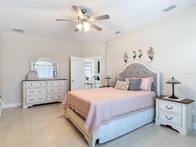 12323 House Finch, Weeki Wachee, FL 34614 - bedroom with light tile patterned floors and ceiling fan