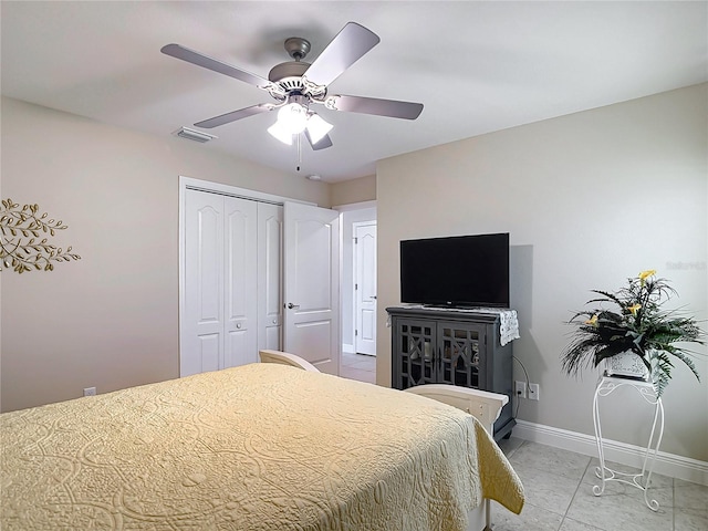 12323 House Finch, Weeki Wachee, FL 34614 - bedroom featuring a closet, a ceiling fan, and light marble finish floors