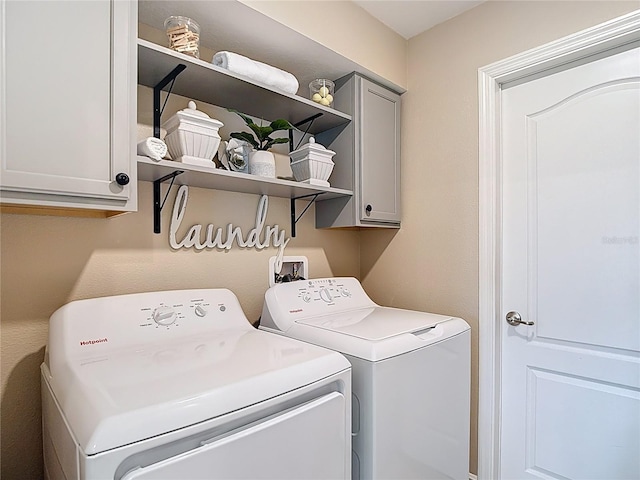 12323 House Finch, Weeki Wachee, FL 34614 - laundry room featuring washing machine and clothes dryer and cabinet space