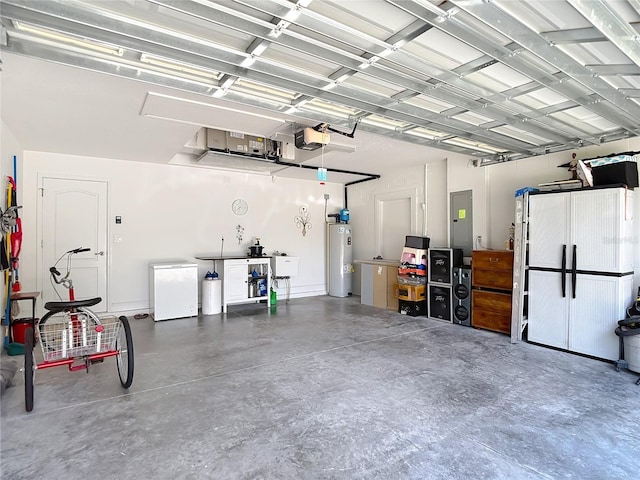 12323 House Finch, Weeki Wachee, FL 34614 - garage with electric water heater, electric panel, a garage door opener, and fridge