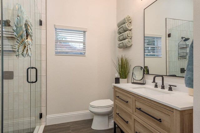 10342 Altrara Way, Trinity, FL 34655 - full bathroom featuring vanity, wood finished floors, and a shower stall