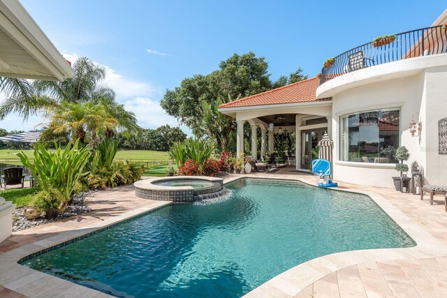 10342 Altrara Way, Trinity, FL 34655 - view of swimming pool featuring a patio area, a pool with connected hot tub, and a ceiling fan
