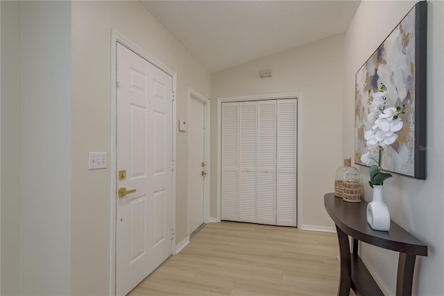 4752 Weasel Dr, New Port Richey, FL 34653 - foyer entrance featuring light wood-style floors and vaulted ceiling