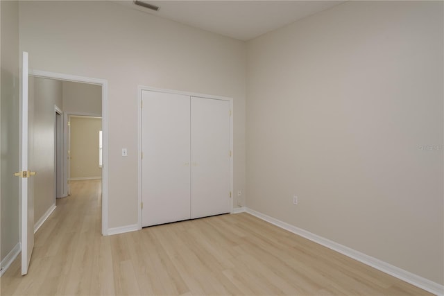 4752 Weasel Dr, New Port Richey, FL 34653 - unfurnished bedroom featuring light wood-type flooring and a closet