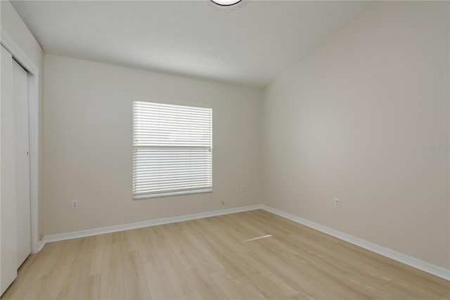 4752 Weasel Dr, New Port Richey, FL 34653 - unfurnished bedroom with light wood finished floors and a closet