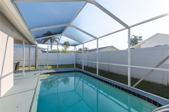 4752 Weasel Dr, New Port Richey, FL 34653 - view of swimming pool featuring a fenced backyard and glass enclosure