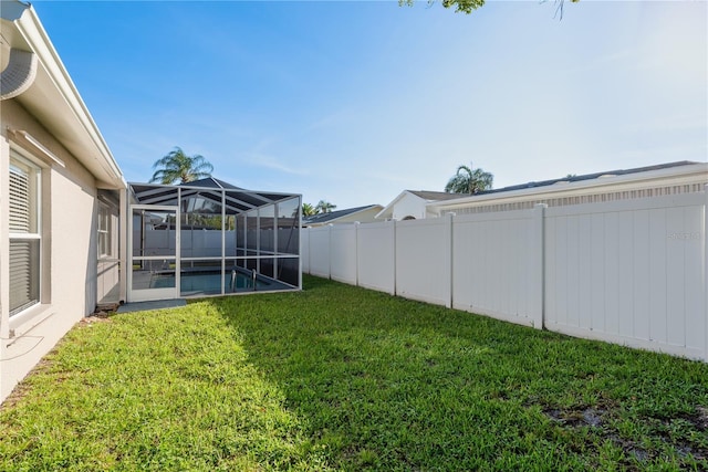 4752 Weasel Dr, New Port Richey, FL 34653 - fenced backyard featuring a lanai