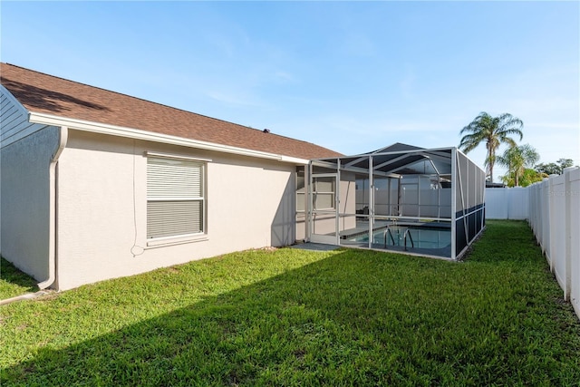 4752 Weasel Dr, New Port Richey, FL 34653 - fenced backyard featuring a lanai