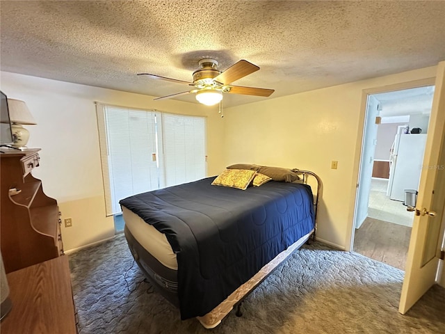 8312 Split Rail Ln, Hudson, FL 34667 - bedroom with a textured ceiling, a ceiling fan, carpet flooring, and freestanding refrigerator
