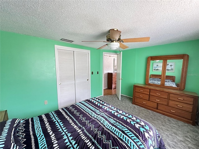 8312 Split Rail Ln, Hudson, FL 34667 - carpeted bedroom featuring a closet, a textured ceiling, and ceiling fan