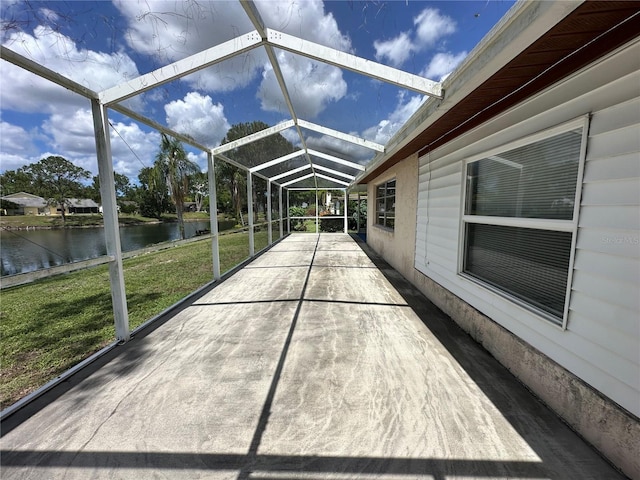8312 Split Rail Ln, Hudson, FL 34667 - unfurnished sunroom featuring a water view and vaulted ceiling