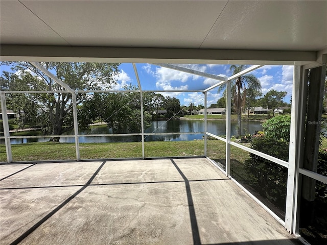 8312 Split Rail Ln, Hudson, FL 34667 - unfurnished sunroom featuring a water view