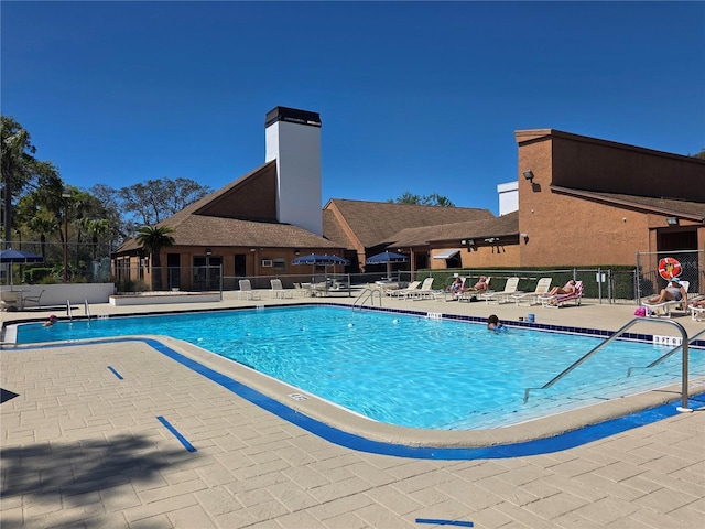 8312 Split Rail Ln, Hudson, FL 34667 - community pool featuring a patio area