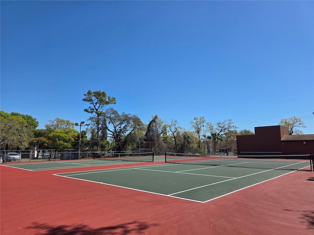8312 Split Rail Ln, Hudson, FL 34667 - view of tennis court with community basketball court