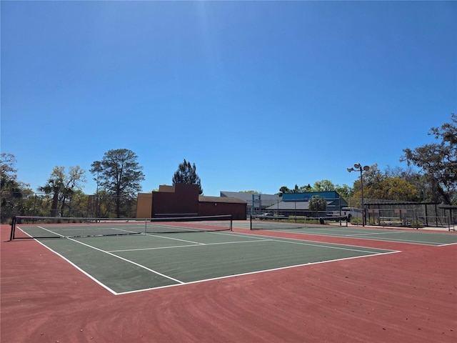 8312 Split Rail Ln, Hudson, FL 34667 - view of tennis court featuring community basketball court