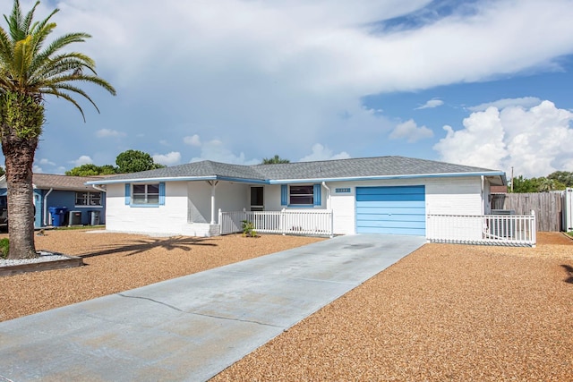 10123 Oak Hill Dr, Port Richey, FL 34668 - ranch-style home featuring a porch, an attached garage, driveway, and brick siding