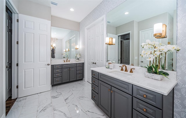 4197 Glade Wood Loop, New Port Richey, FL 34655 - full bath with two vanities, marble look tiles, and recessed lighting