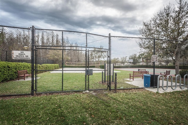 4197 Glade Wood Loop, New Port Richey, FL 34655 - view of tennis court featuring a gate