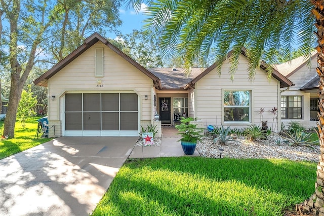 2342 Countryside Dr, Spring Hill, FL 34606 - ranch-style house featuring driveway, an attached garage, and a front lawn