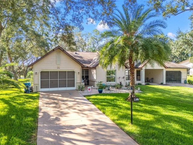 2342 Countryside Dr, Spring Hill, FL 34606 - ranch-style house with a garage, concrete driveway, and a front yard