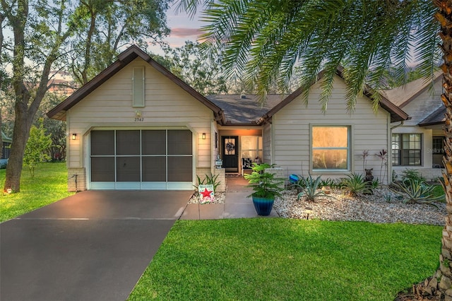 2342 Countryside Dr, Spring Hill, FL 34606 - ranch-style house featuring concrete driveway, a garage, and a yard