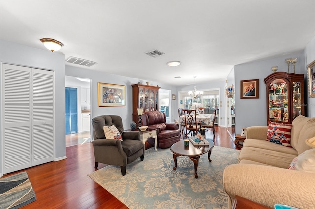 2342 Countryside Dr, Spring Hill, FL 34606 - living room with a chandelier and dark wood-type flooring