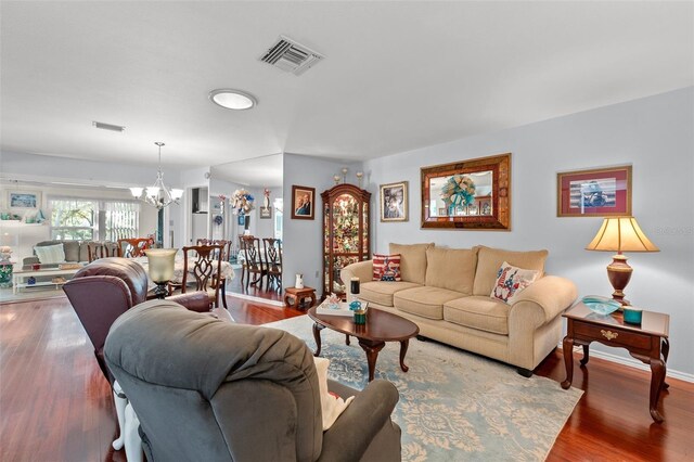 2342 Countryside Dr, Spring Hill, FL 34606 - living room with a chandelier and wood finished floors