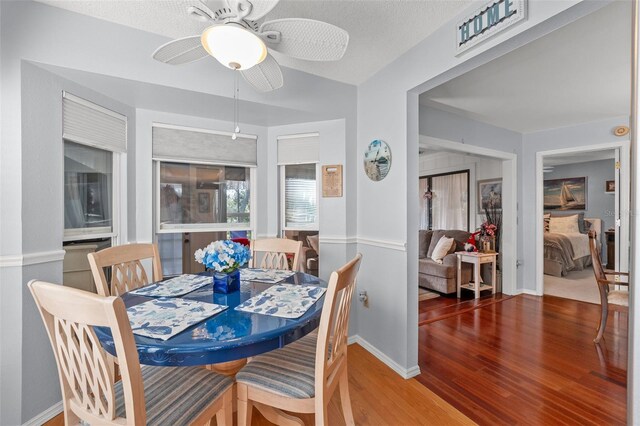 2342 Countryside Dr, Spring Hill, FL 34606 - dining room featuring wood finished floors and ceiling fan