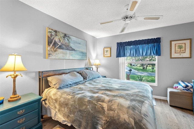 2342 Countryside Dr, Spring Hill, FL 34606 - bedroom with wood finished floors, a textured ceiling, and a ceiling fan