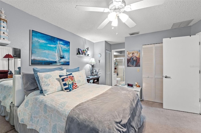 2342 Countryside Dr, Spring Hill, FL 34606 - carpeted bedroom featuring a textured ceiling, ensuite bath, and a ceiling fan
