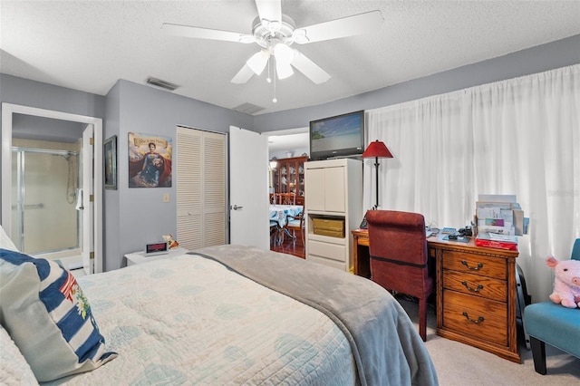2342 Countryside Dr, Spring Hill, FL 34606 - bedroom featuring light carpet, a closet, a ceiling fan, and a textured ceiling
