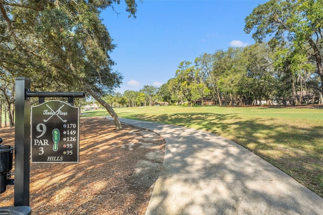 2342 Countryside Dr, Spring Hill, FL 34606 - surrounding community with a yard and view of wooded area