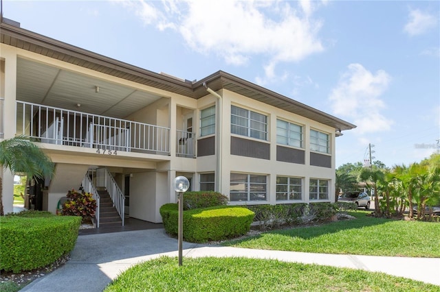 4754 Marine Pkwy Unit 103, New Port Richey, FL 34652 - view of building exterior featuring stairs
