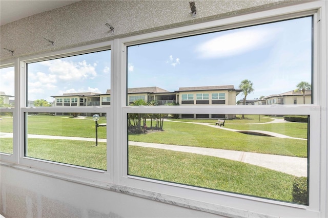 4754 Marine Pkwy Unit 103, New Port Richey, FL 34652 - unfurnished sunroom featuring a residential view
