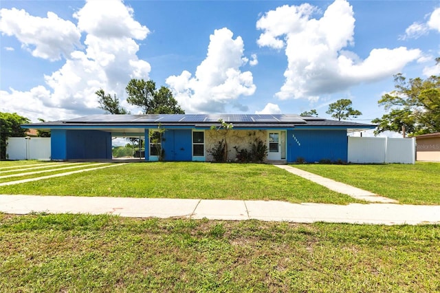 22348 Olean Blvd, Port Charlotte, FL 33952 - view of front of home with roof mounted solar panels and an attached carport