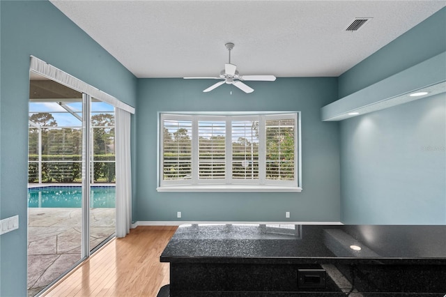 4351 Mallard Lake Dr, Spring Hill, FL 34609 - dining area with healthy amount of natural light, ceiling fan, and wood finished floors