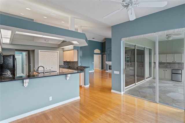 4351 Mallard Lake Dr, Spring Hill, FL 34609 - kitchen with a ceiling fan, refrigerator, dark countertops, freestanding refrigerator, and lofted ceiling