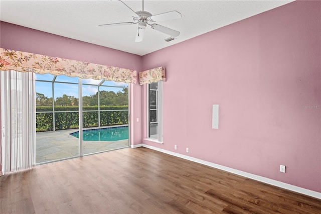 4351 Mallard Lake Dr, Spring Hill, FL 34609 - unfurnished room with wood finished floors and ceiling fan