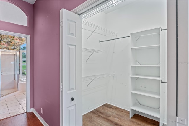 4351 Mallard Lake Dr, Spring Hill, FL 34609 - walk in closet featuring wood finished floors