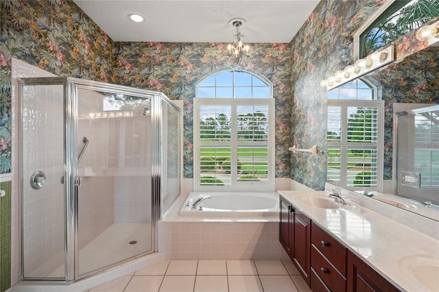4351 Mallard Lake Dr, Spring Hill, FL 34609 - bathroom with healthy amount of natural light, double vanity, tile patterned floors, a bath, and wallpapered walls