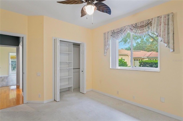 4351 Mallard Lake Dr, Spring Hill, FL 34609 - unfurnished bedroom featuring carpet, a closet, and ceiling fan