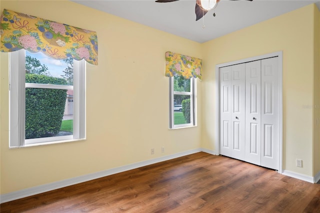4351 Mallard Lake Dr, Spring Hill, FL 34609 - unfurnished bedroom featuring wood finished floors, a closet, and ceiling fan