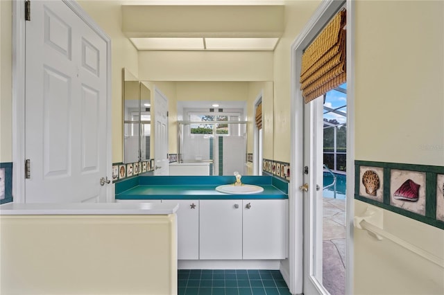 4351 Mallard Lake Dr, Spring Hill, FL 34609 - full bath featuring vanity, plenty of natural light, tile patterned flooring, and a shower