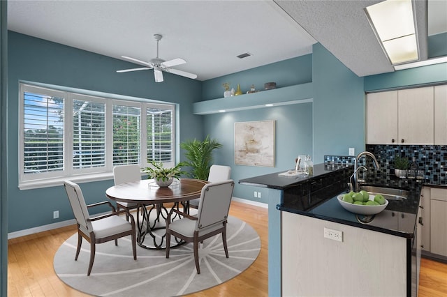 4351 Mallard Lake Dr, Spring Hill, FL 34609 - dining area with a ceiling fan and light wood-type flooring
