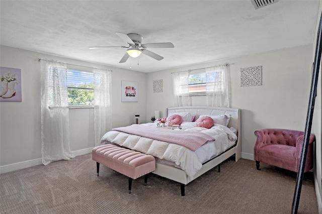 6144 Glenwood Dr, New Port Richey, FL 34653 - carpeted bedroom with baseboards and a ceiling fan