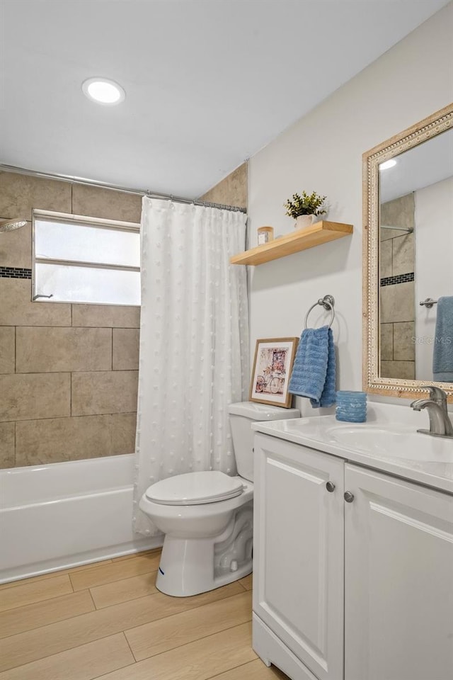 6144 Glenwood Dr, New Port Richey, FL 34653 - bathroom featuring vanity, shower / bath combination with curtain, and wood finished floors