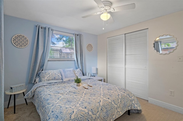 6144 Glenwood Dr, New Port Richey, FL 34653 - bedroom featuring light colored carpet, a closet, and a ceiling fan
